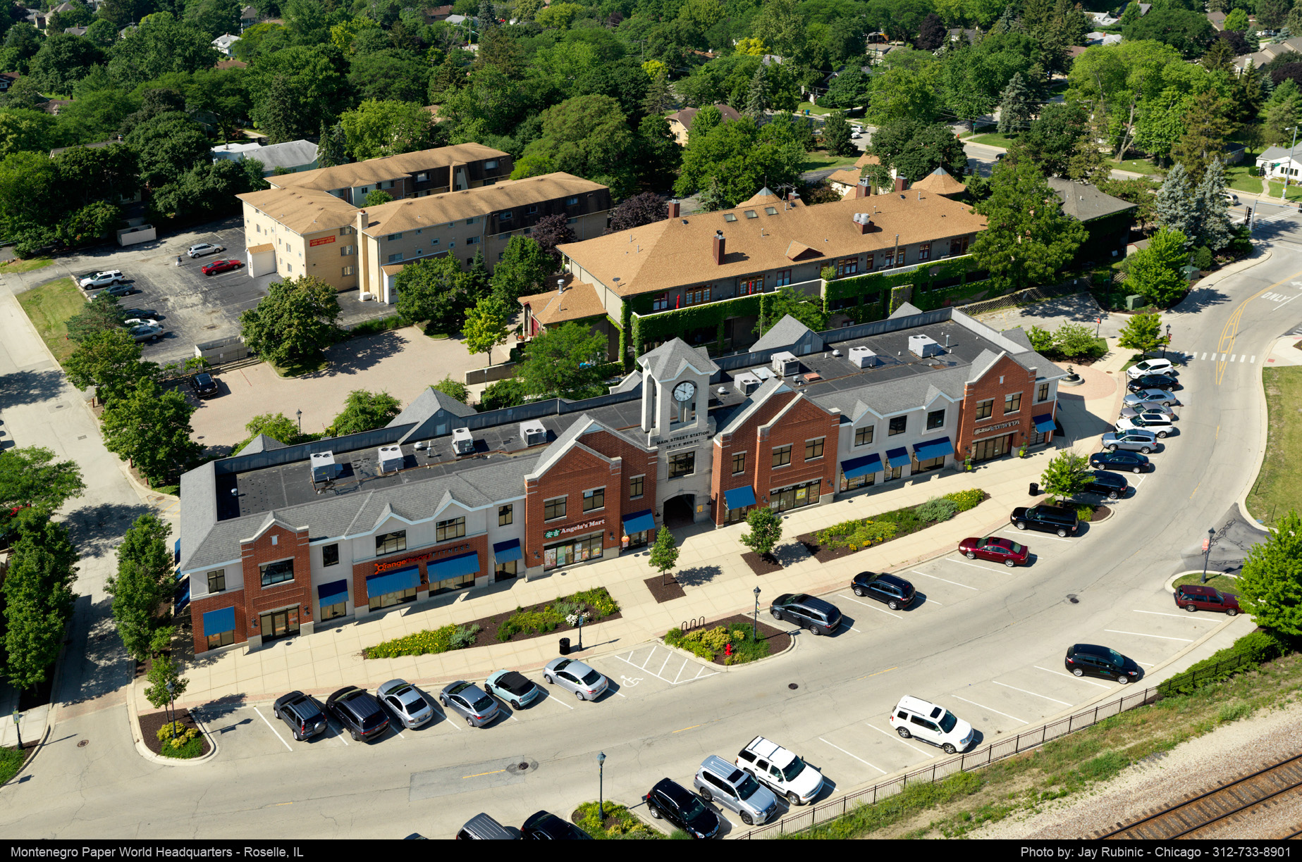 Montenegro Paper World Headquarters in Roselle, IL, featuring Angela's Mart. Aerial view of the office building and parking lot.