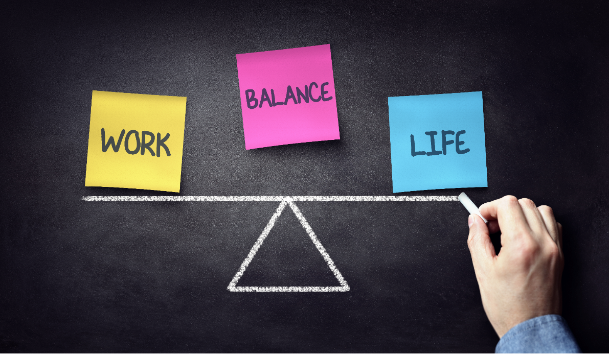 Work-life balance concept with sticky notes on a seesaw. Balance, work, life.