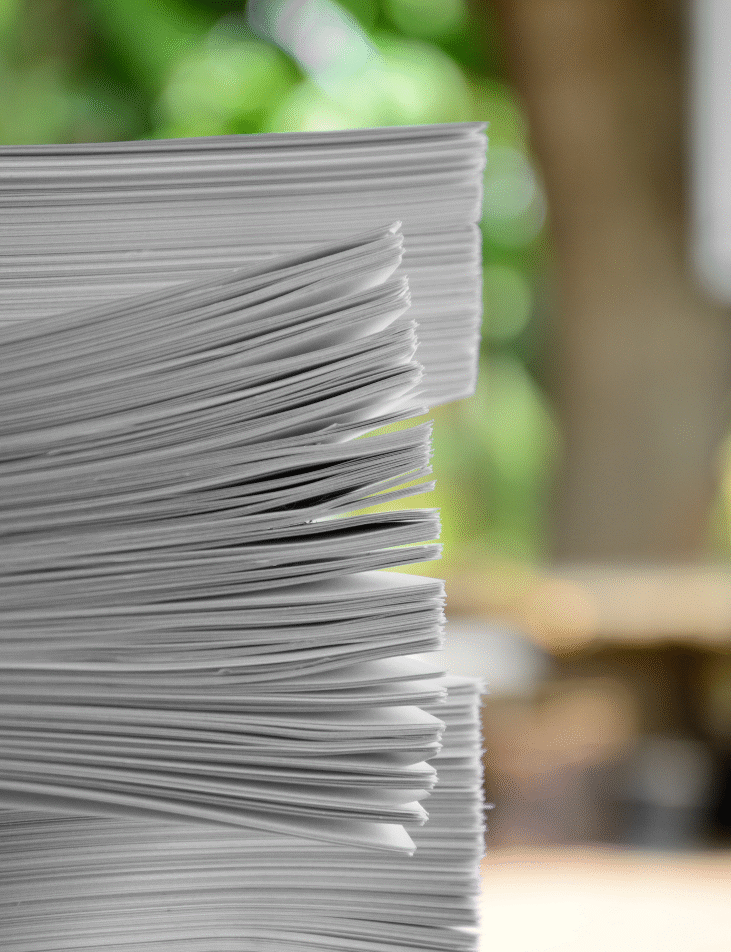 Stack of white printer paper, close-up.