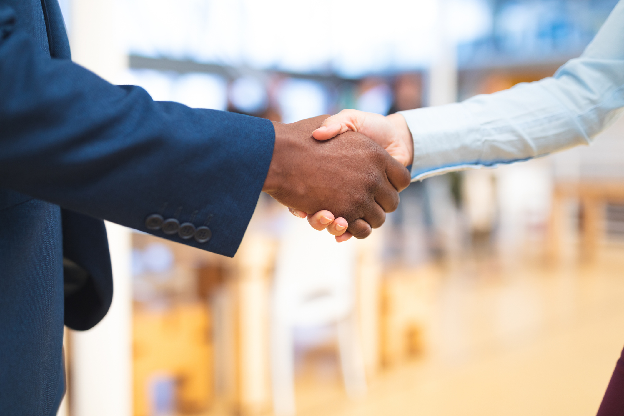 Handshake between two professionals, symbolizing a successful print partner relationship.